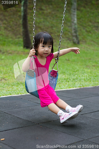 Image of Asian Kid Swing At Park