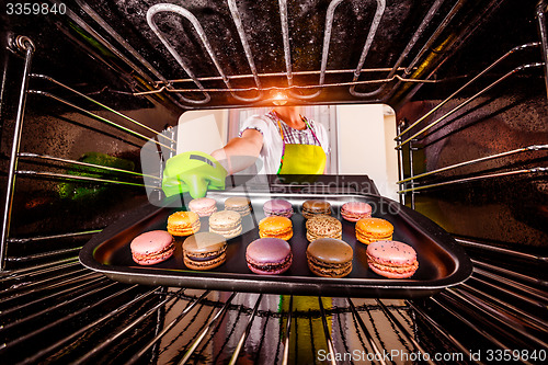 Image of Baking macarons in the oven.