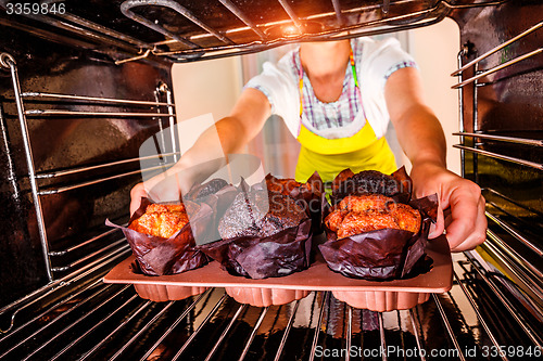 Image of Baking muffins in the oven