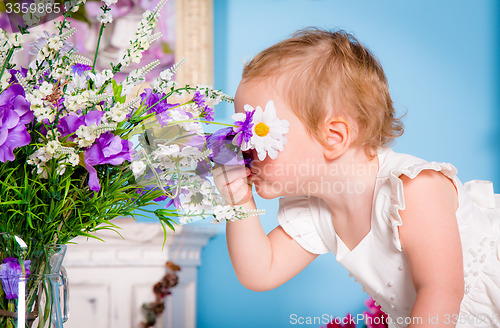 Image of Little girl and flower