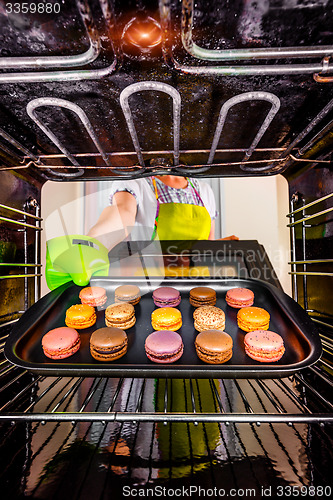 Image of Baking macarons in the oven.