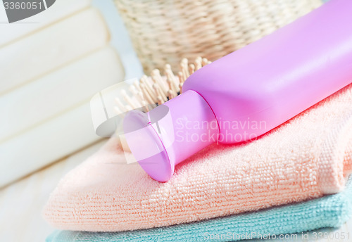 Image of color towels and shampoo