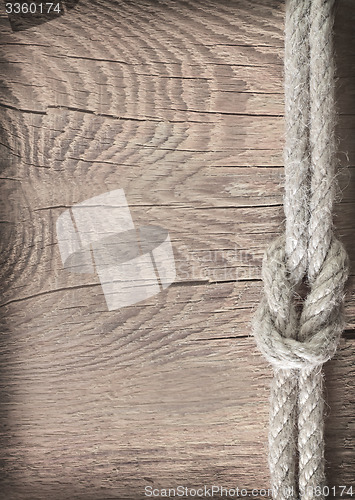 Image of rope on wooden background