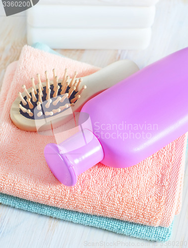 Image of color towels and shampoo