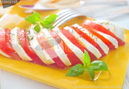 Image of caprese, fresh salad with tomato and mozzarella