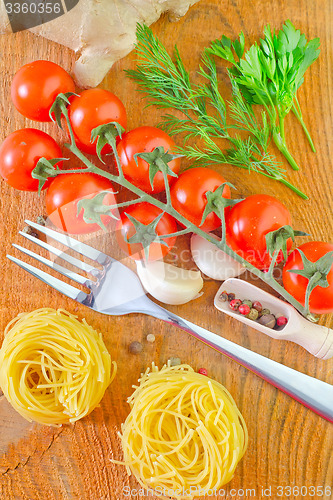 Image of raw pasta and tomato