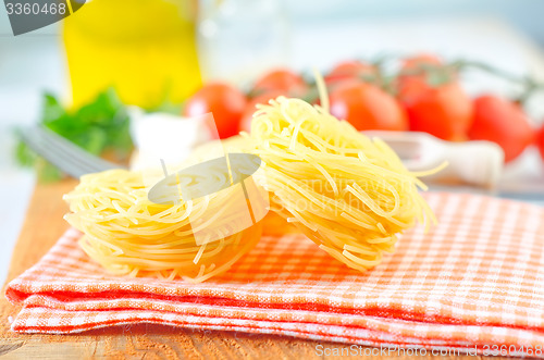 Image of raw pasta and tomato