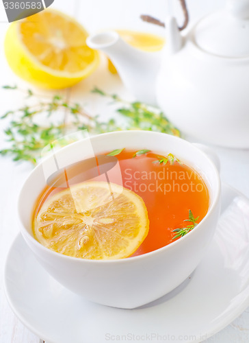 Image of Fresh tea with lemon in the white cup