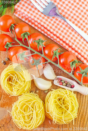 Image of raw pasta and tomato