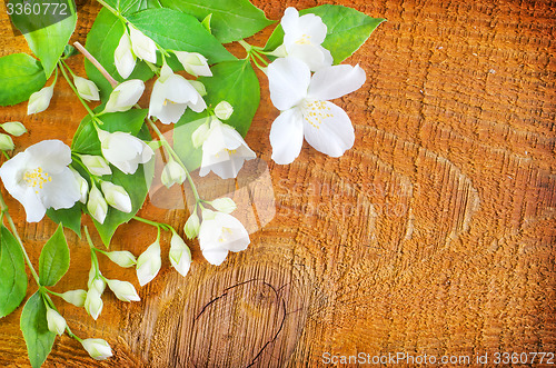 Image of jasmin on wooden background