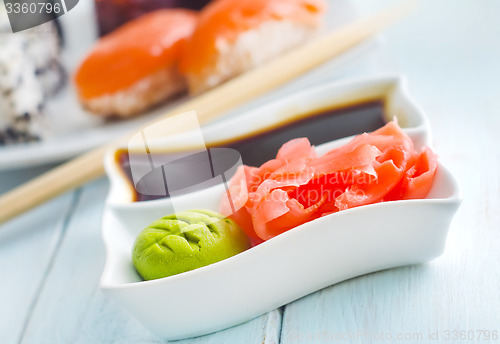 Image of ginger, vasabi and soy sauce in white bowl