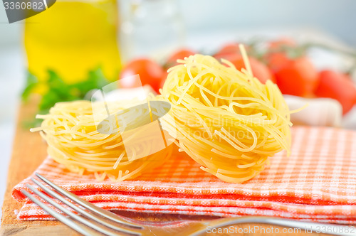 Image of raw pasta and tomato