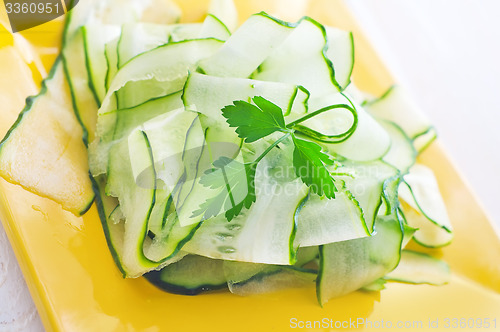Image of Fresh salad with fresh cucumber and parsley
