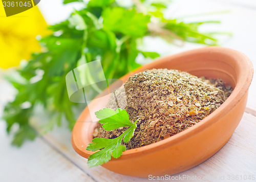 Image of Dry parsley in the bowl, green parsley