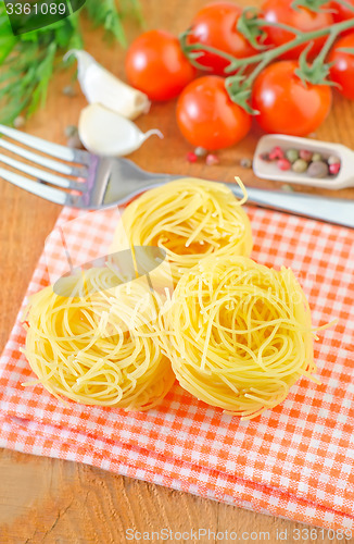 Image of raw pasta and tomato