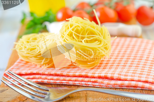 Image of raw pasta and tomato