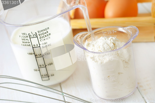 Image of ingredients for dough, eggs, flour and milk