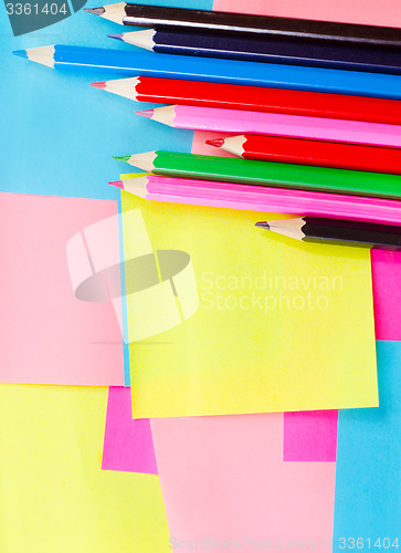 Image of color paper and pencils