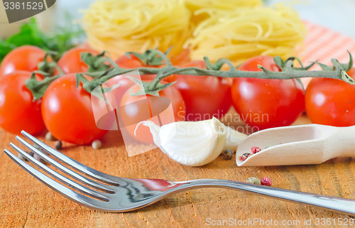 Image of raw pasta and tomato