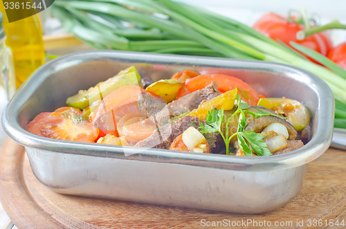 Image of baked meat with vegetables