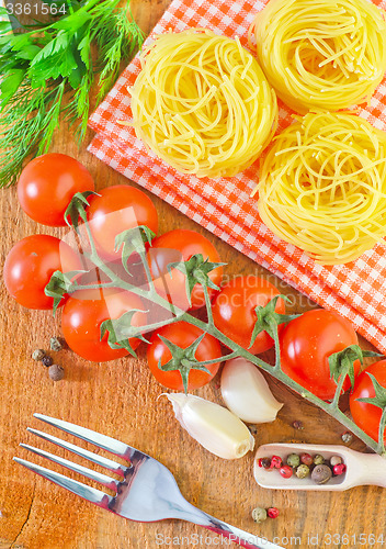 Image of raw pasta and tomato