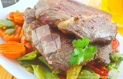 Image of baked meat with vegetables