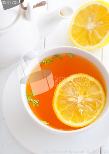 Image of Fresh tea with lemon in the white cup