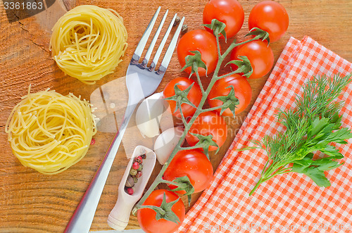 Image of raw pasta and tomato
