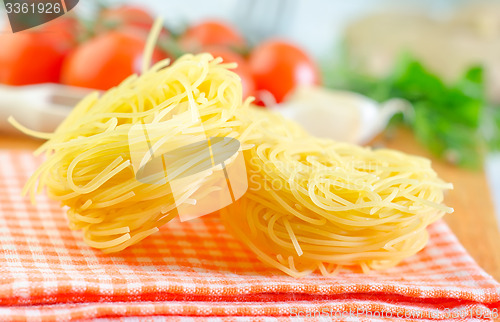 Image of raw pasta and tomato