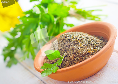 Image of Dry parsley in the bowl, green parsley