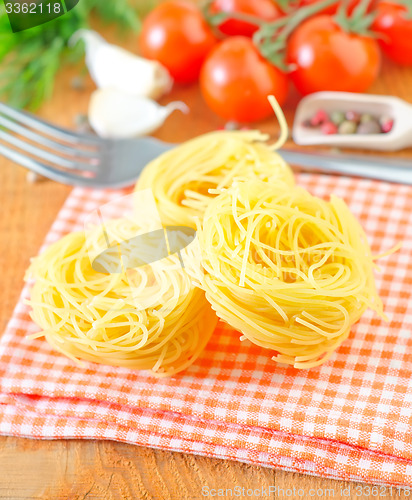 Image of raw pasta and tomato