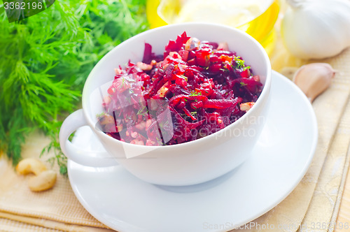 Image of Fresh salad with beet and walnuts, vegetarian salad