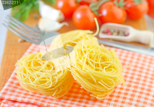 Image of raw pasta and tomato