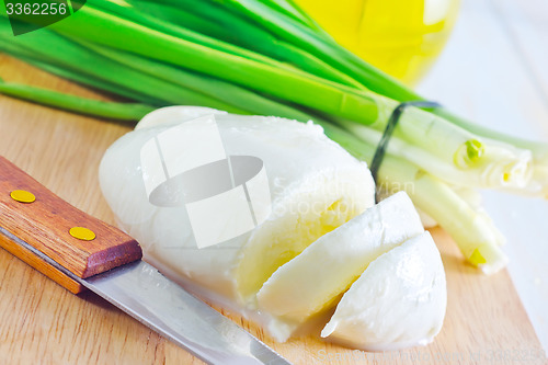 Image of fresh mozzarella on the wooden board