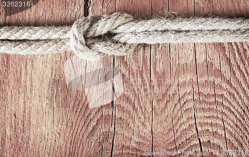 Image of rope on wooden background