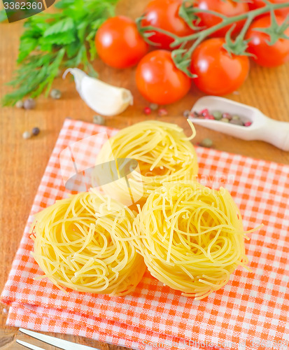 Image of raw pasta and tomato