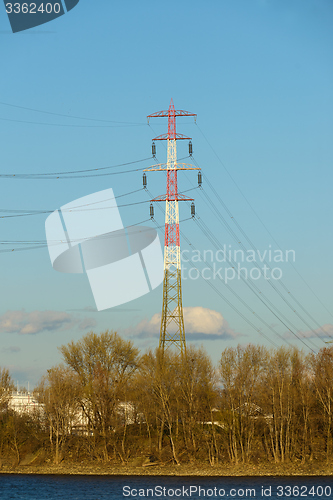 Image of Large electric pylon with blue sky