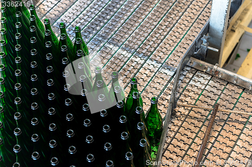 Image of Many bottles on conveyor belt