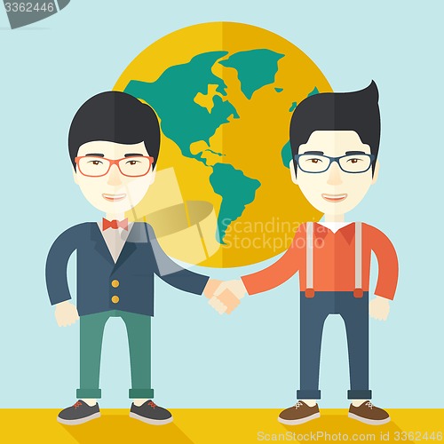 Image of Two chinese guys happily handshaking.