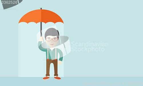 Image of Successful man with umbrella.