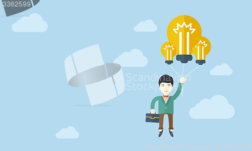 Image of Asian businessman carrying a briefcase with bulb.