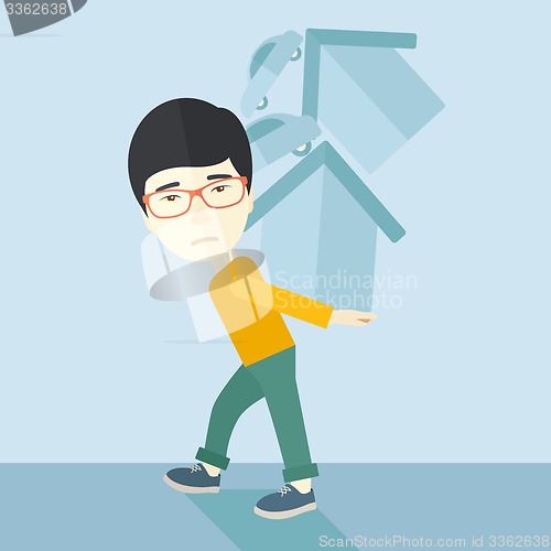 Image of Chinese man carrying house and car