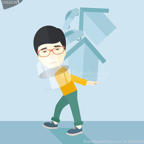 Image of Chinese man carrying house and car