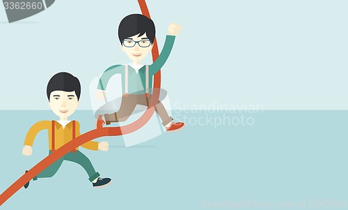 Image of Two asian guy running to finish line.