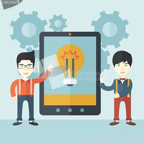 Image of Two businessmen holding big screen tablet.