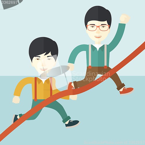 Image of Two asian guy running to finish line.