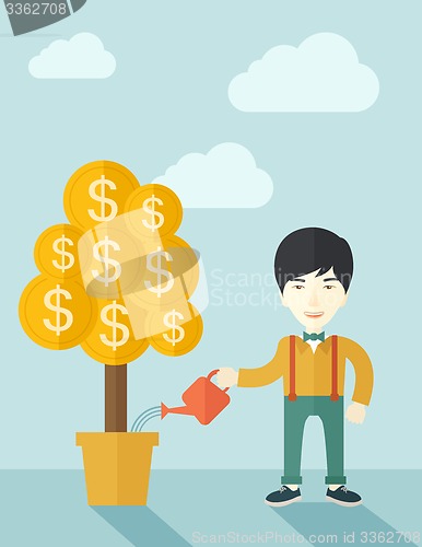 Image of Asian businessman happily watering the money tree.