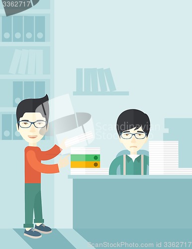 Image of Two asian office clerk inside the office.