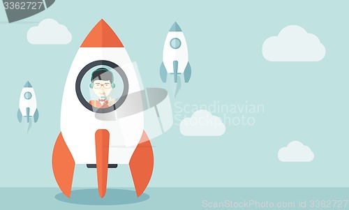 Image of Young asian guy in side the rocket.