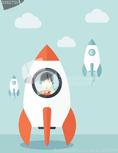Image of Young asian guy in side the rocket.